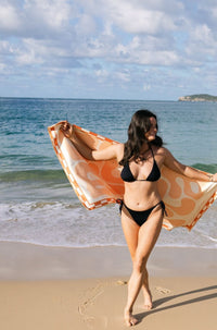 Lost Sol Mallorca Pastel soft peach lightweight travel towel, lifestyle photo