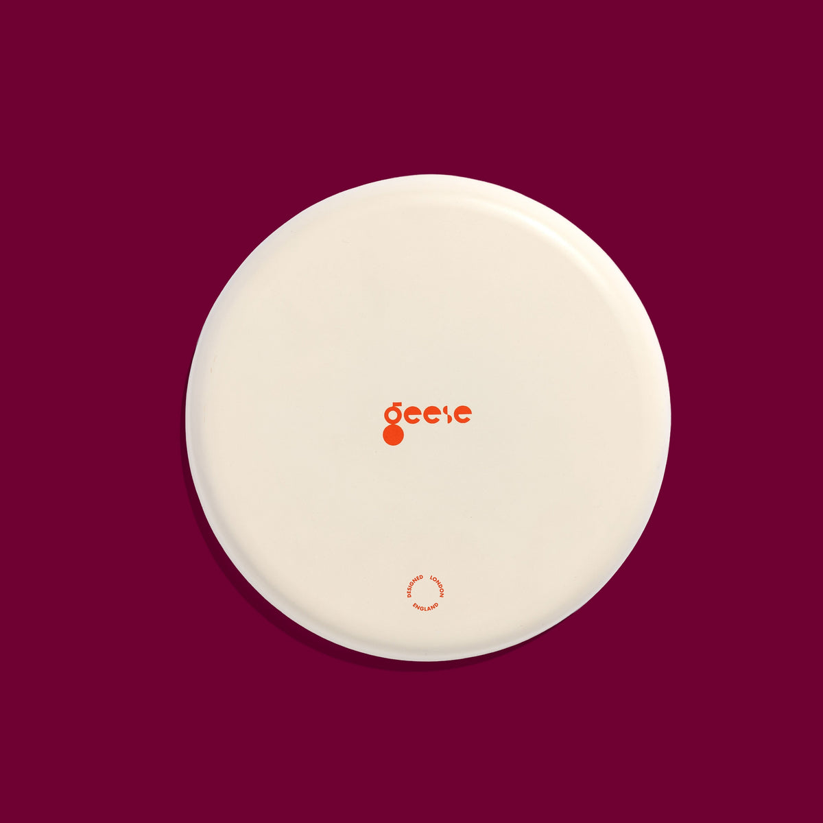 Zest round enamel tray in cream with green and pink stripes by Geese