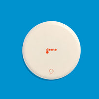 Zone round enamel tray in cream with a large blue cross by Geese