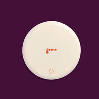 Zone round enamel tray in pink with a large purple cross by Geese
