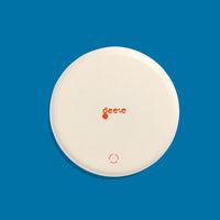 Zoom round enamel tray with multicoloured circles in blue, pink, yellow and green by Geese
