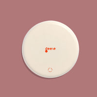 Zulu round enamel tray in dark grey with six pink dots by Geese
