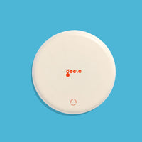 Zoom round enamel tray with multicoloured circles in pink, blue, orange, yellow and black by Geese