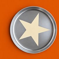Zeus round enamelled aluminium tray with a cream star motif by Geese