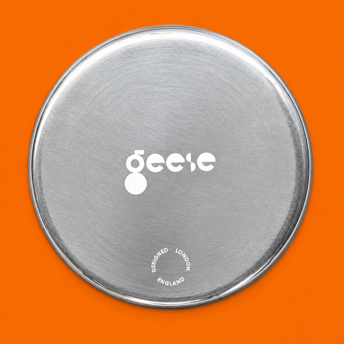 Zeus round enamelled aluminium tray with a cream star motif by Geese