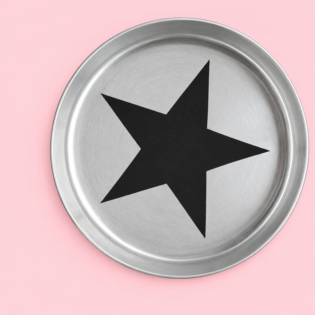 Zeus round enamelled aluminium tray with a black star motif by Geese