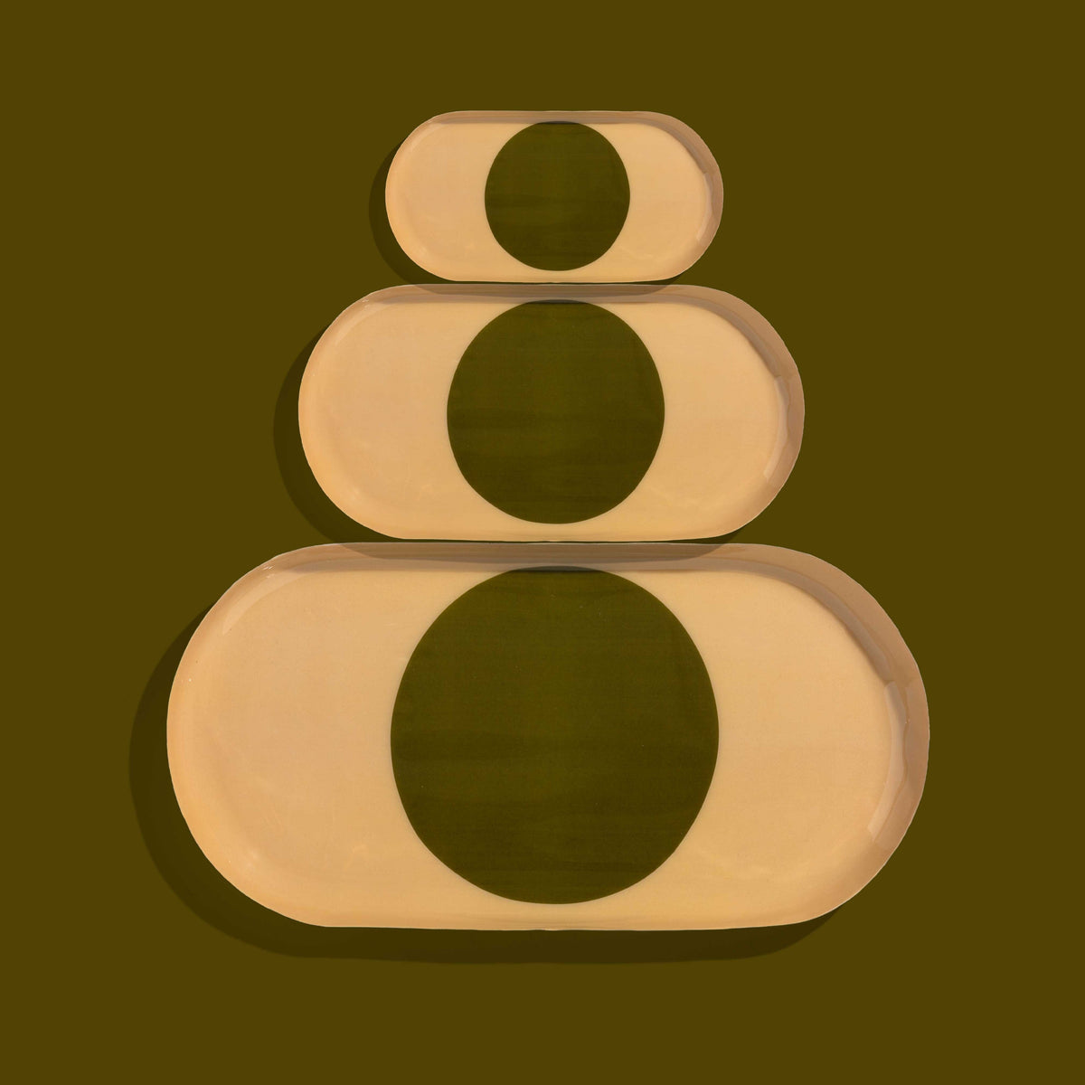 Zen capsule enamel tray in cream with a bold olive circle design by Geese