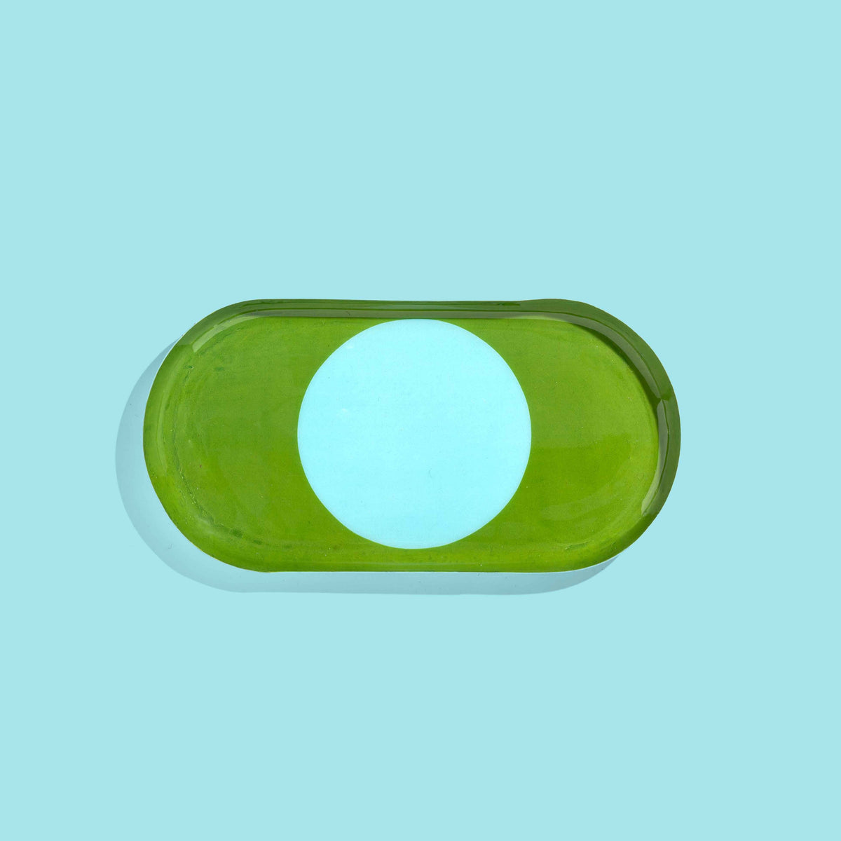 Zen capsule enamel tray in green with a bold blue circle design by Geese