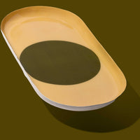 Zen capsule enamel tray in cream with a bold olive circle design by Geese