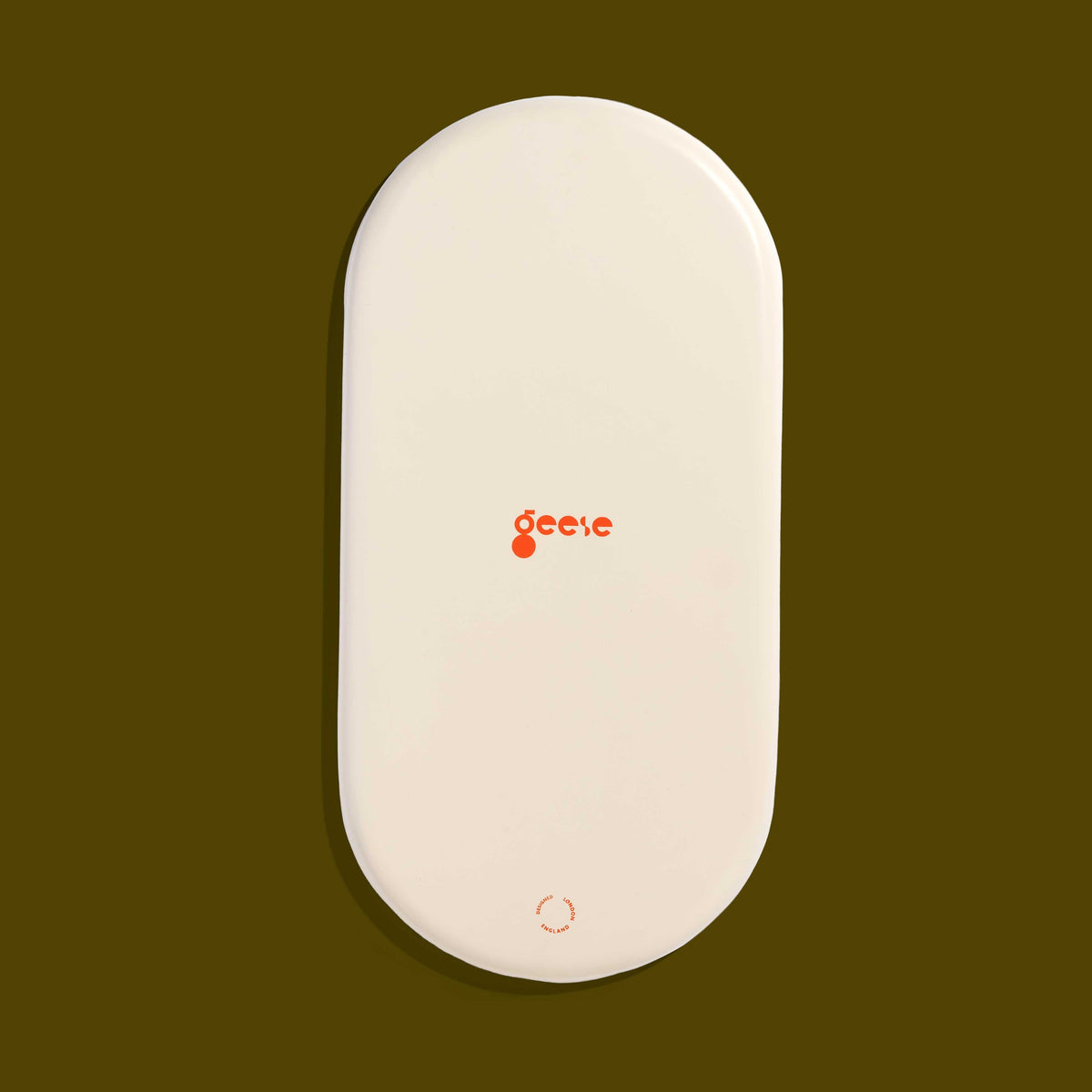 Zen capsule enamel tray in cream with a bold olive circle design by Geese