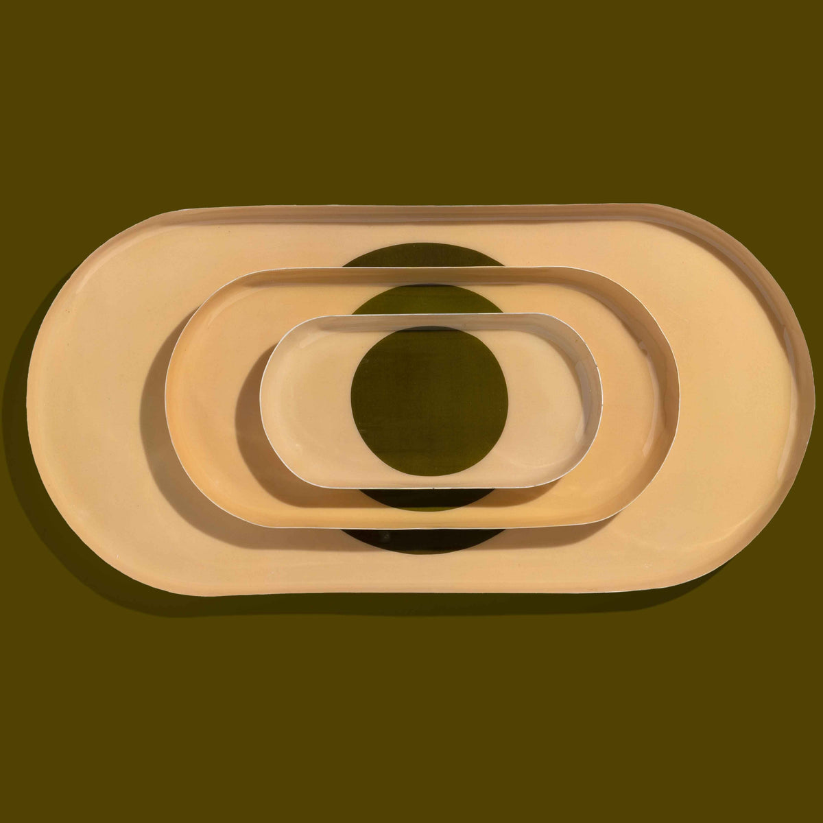 Zen capsule enamel tray in cream with a bold olive circle design by Geese