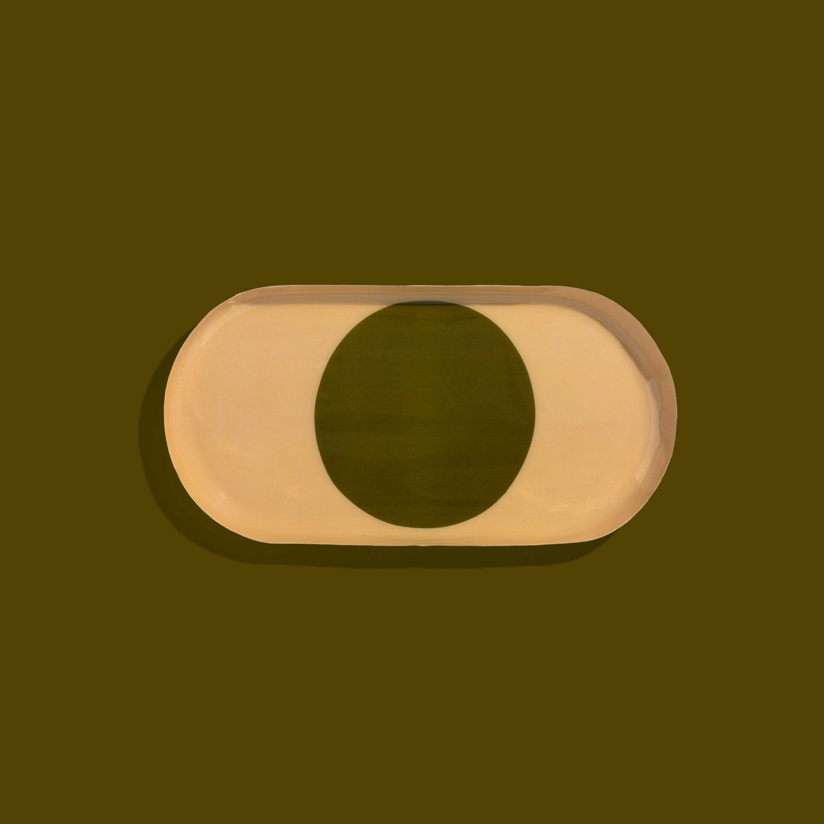 Zen capsule enamel tray in cream with a bold olive circle design by Geese