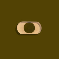 Zen capsule enamel tray in cream with a bold olive circle design by Geese