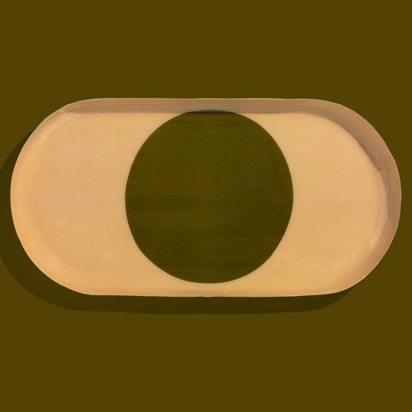 Zen capsule enamel tray in cream with a bold olive circle design by Geese