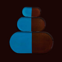 Zephyr capsule enamel tray with a split design in brown and blue by Geese