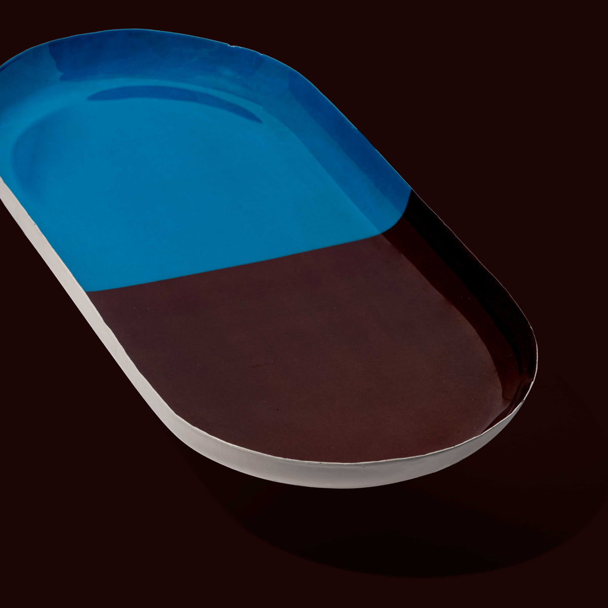 Zephyr capsule enamel tray with a split design in brown and blue by Geese