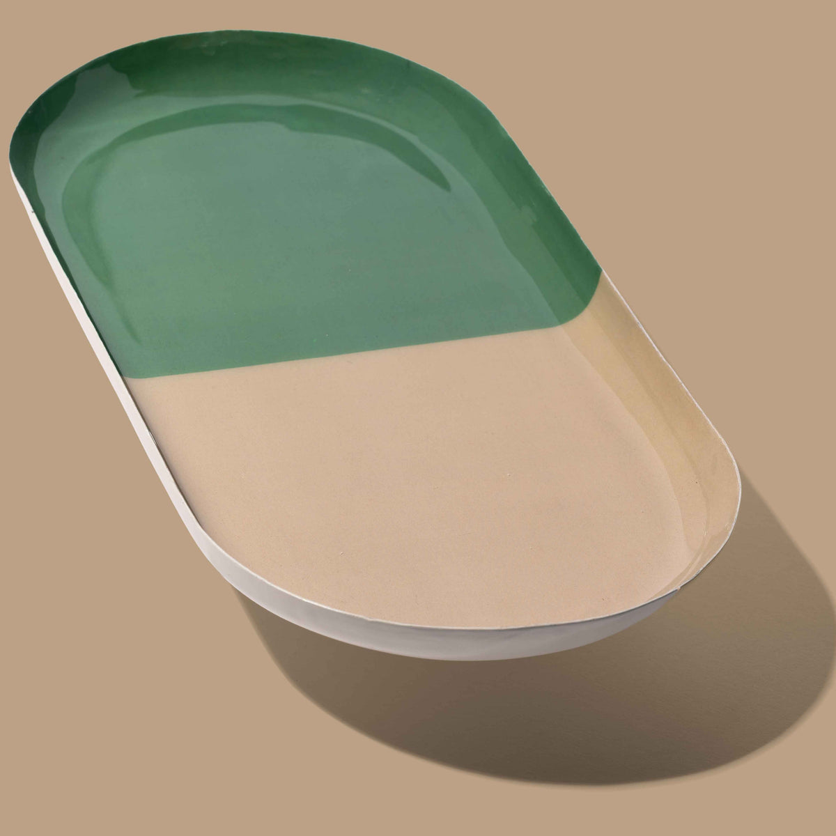 Zephyr capsule enamel tray with a split design in green and cream by Geese