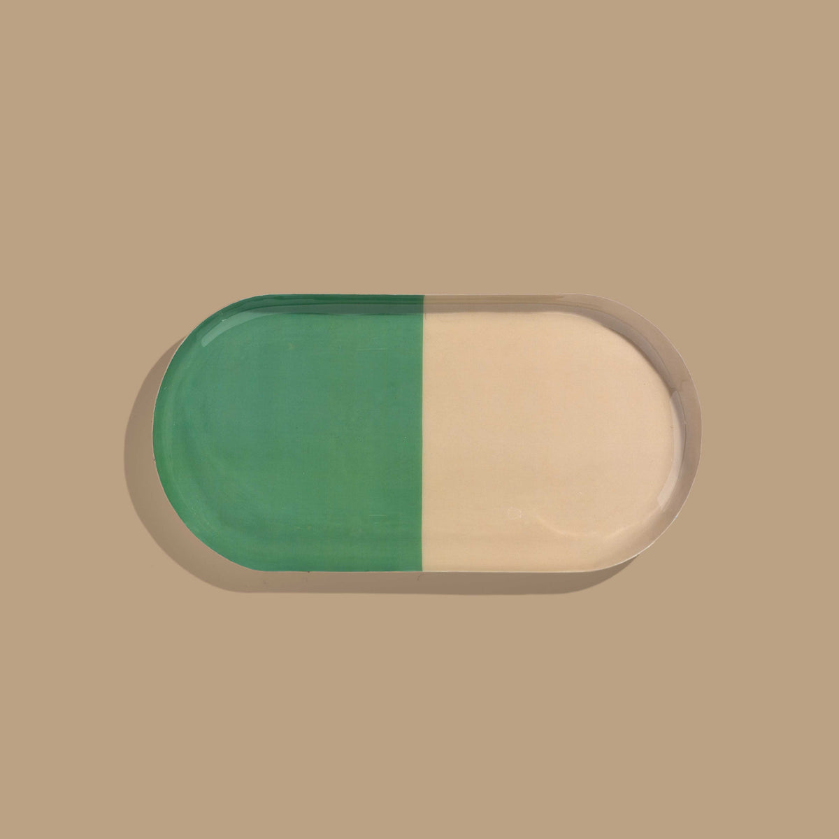 Zephyr capsule enamel tray with a split design in green and cream by Geese