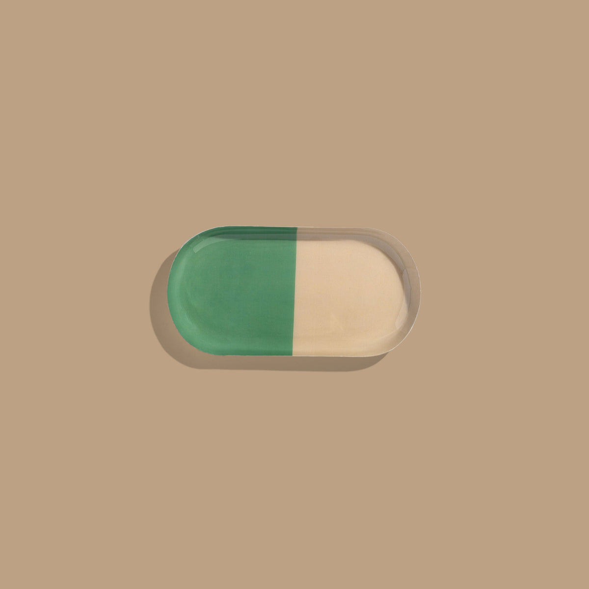 Zephyr capsule enamel tray with a split design in green and cream by Geese