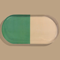 Zephyr capsule enamel tray with a split design in green and cream by Geese