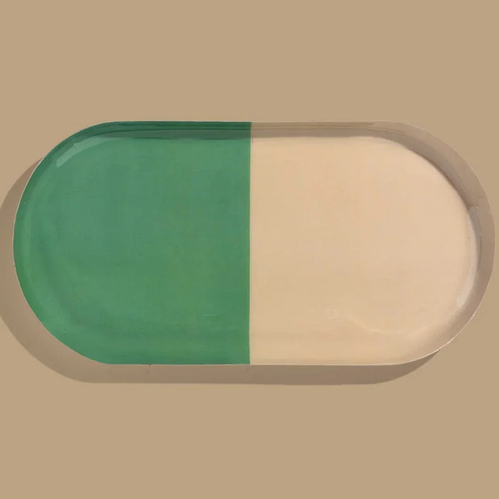 Zephyr capsule enamel tray with a split design in green and cream by Geese