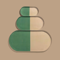 Zephyr capsule enamel tray with a split design in green and cream by Geese