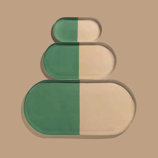 Zephyr capsule enamel tray with a split design in green and cream by Geese