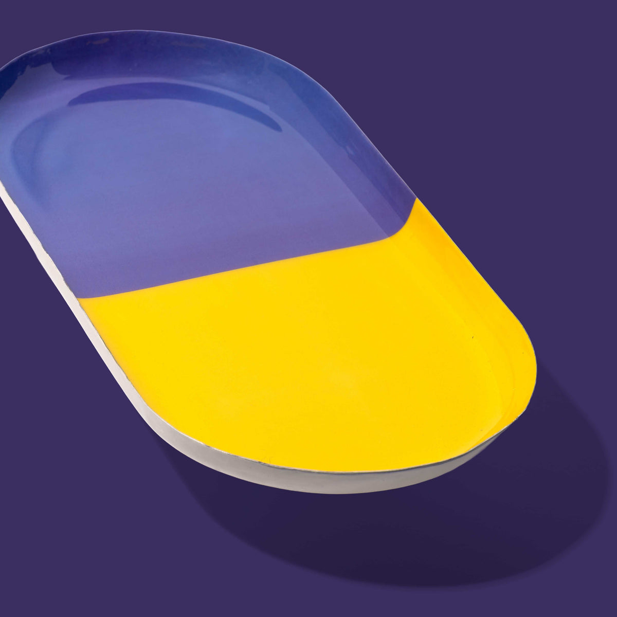 Zephyr capsule enamel tray with a split design in yellow and purple by Geese