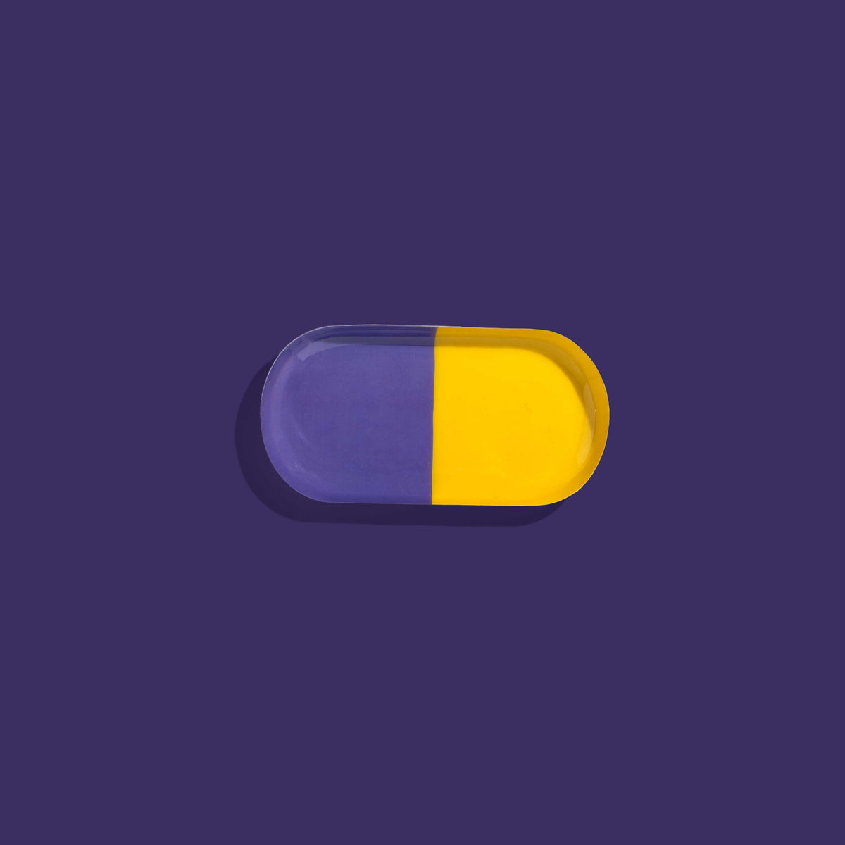 Zephyr capsule enamel tray with a split design in yellow and purple by Geese