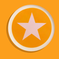 Zodiac round enamel tray in orange with a pale pink star and rim by Geese