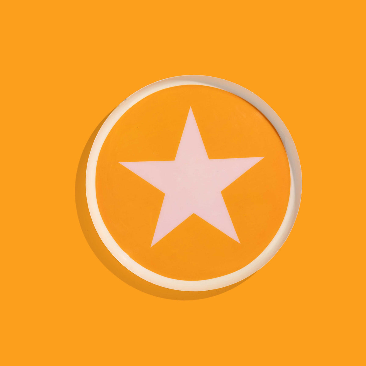 Zodiac round enamel tray in orange with a pale pink star and rim by Geese