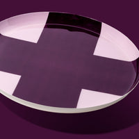 Zone round enamel tray in pink with a large purple cross by Geese