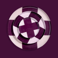 Zone round enamel tray in pink with a large purple cross by Geese