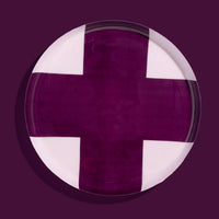 Zone round enamel tray in pink with a large purple cross by Geese