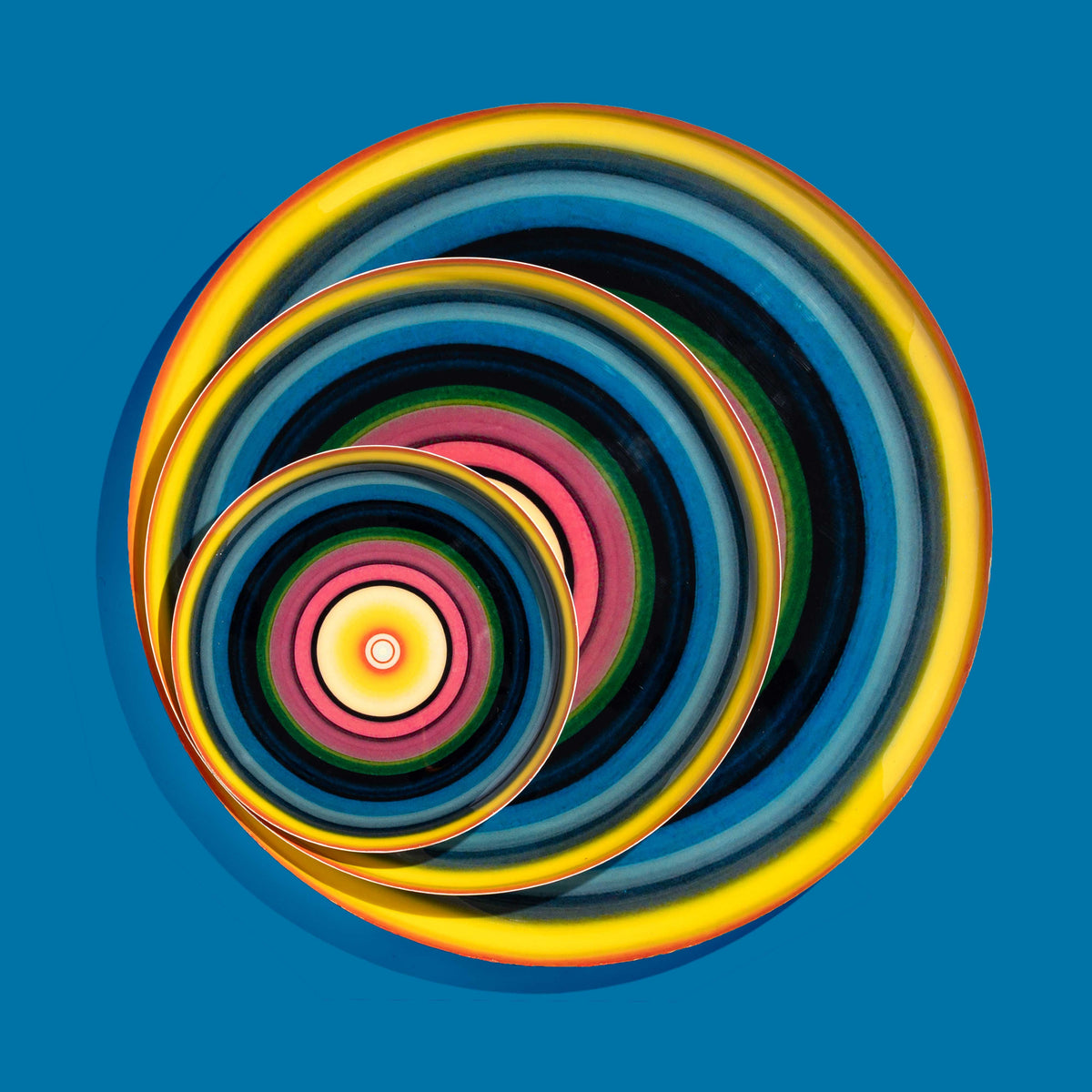 Zoom round enamel tray with multicoloured circles in blue, pink, yellow and green by Geese