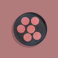 Zulu round enamel tray in dark grey with six pink dots by Geese