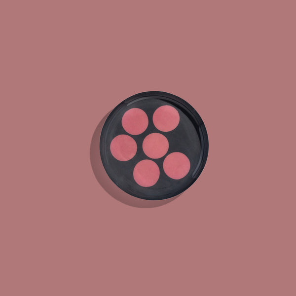 Zulu round enamel tray in dark grey with six pink dots by Geese