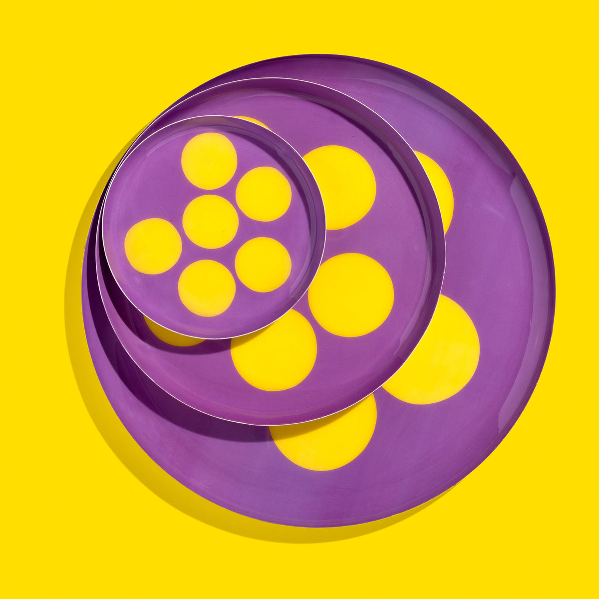 Zulu round enamel tray in purple with six yellow dots by Geese