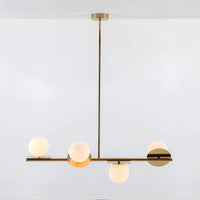 Brass Opal Disk Ceiling Light . A horizontal brass metal stems holds 4 metal disks at varying angles, each topped with an opal glass shade. Light is on.