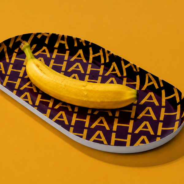 Zaha capsule enamel tray in deep purple with HAHAHA lettering in yellow by Geese