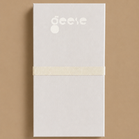 Zephyr capsule enamel tray with a split design in green and cream by Geese