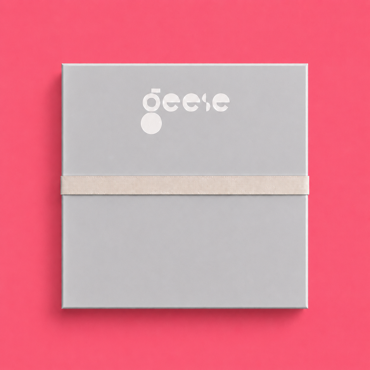Zoom round enamel tray with multicoloured circles in orange, blue, black and pink by Geese