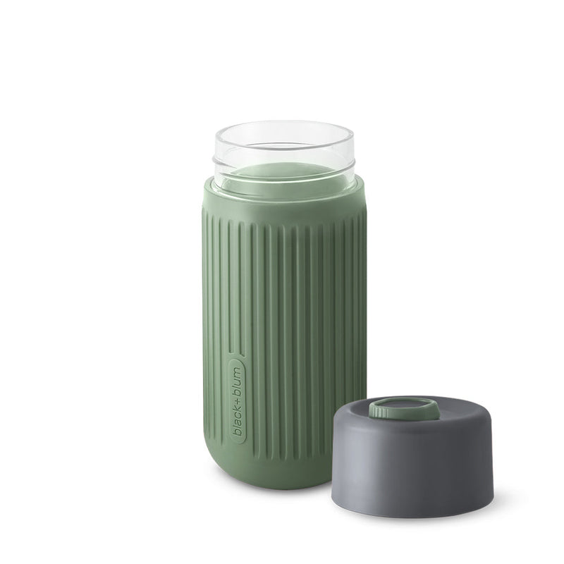 Olive Glass Travel Cup with silicone cover and leak proof lid removed to reveal smooth rim cup